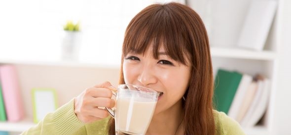 Asian woman enjoying U.S. dairy